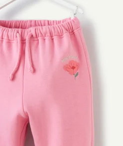 Jogging bébé fille en fibres recyclées rose avec motif mini pousse