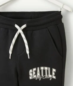 Jogging garçon en fibres recyclées noir thème campus