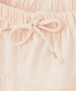 Jupe fille en coton rose pâle avec broderies et volants