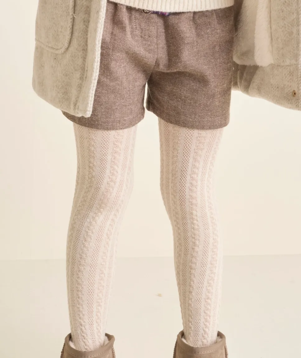 Les collants écrus avec torsades