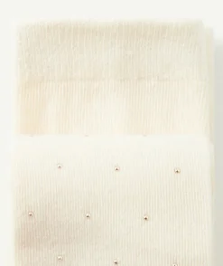 Paire de collants en maille écrus avec pois couleur dorée fille