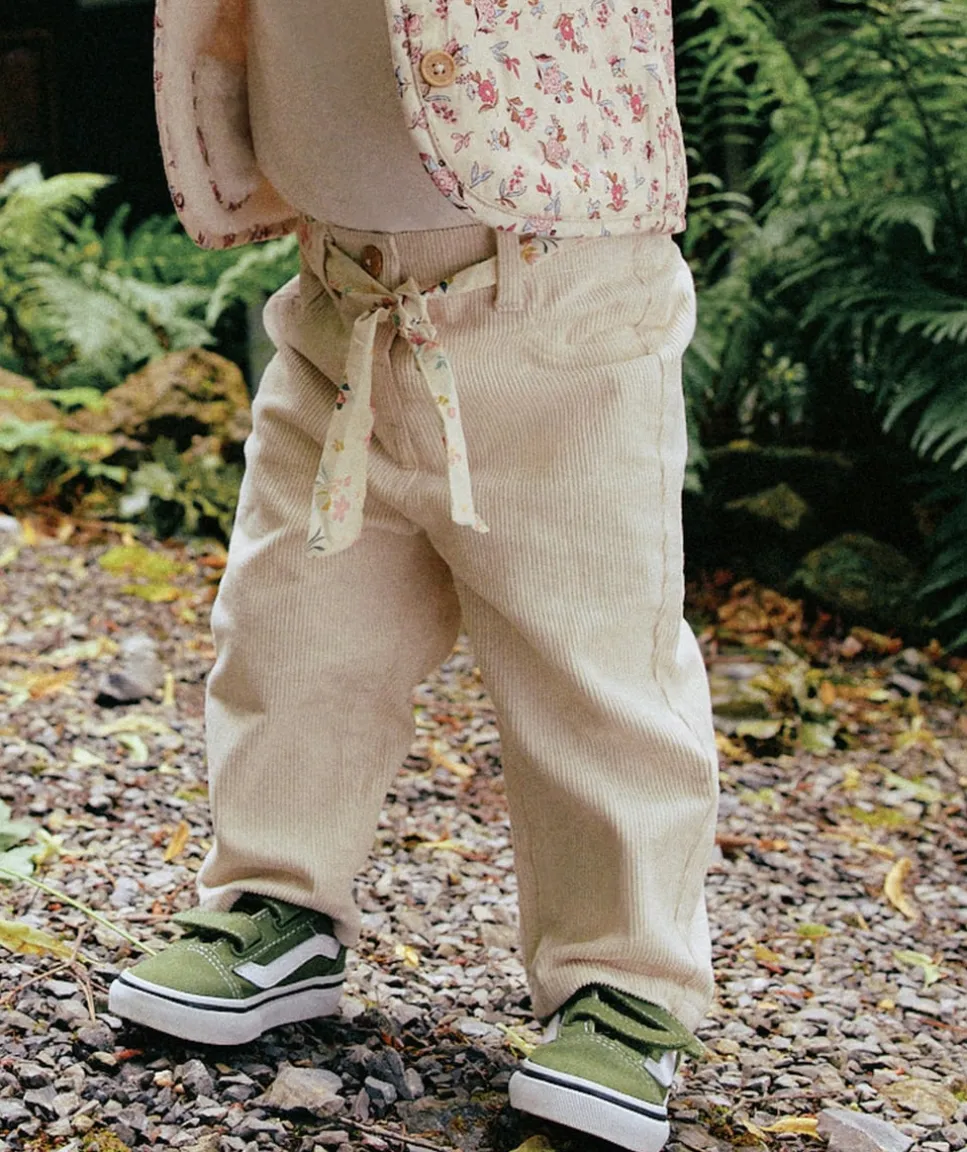 Pantalon bébé fille rose clair avec ceinture fleurie
