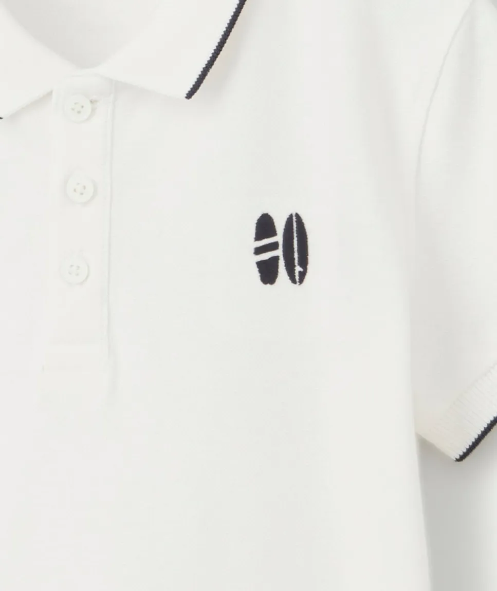 Polo garçon en coton blanc avec surf brodé