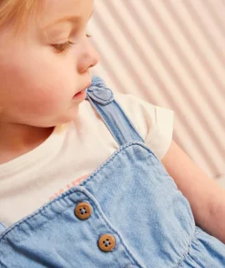 Robe bébé fille en denim léger et lower impact bleu avec broderie fleur