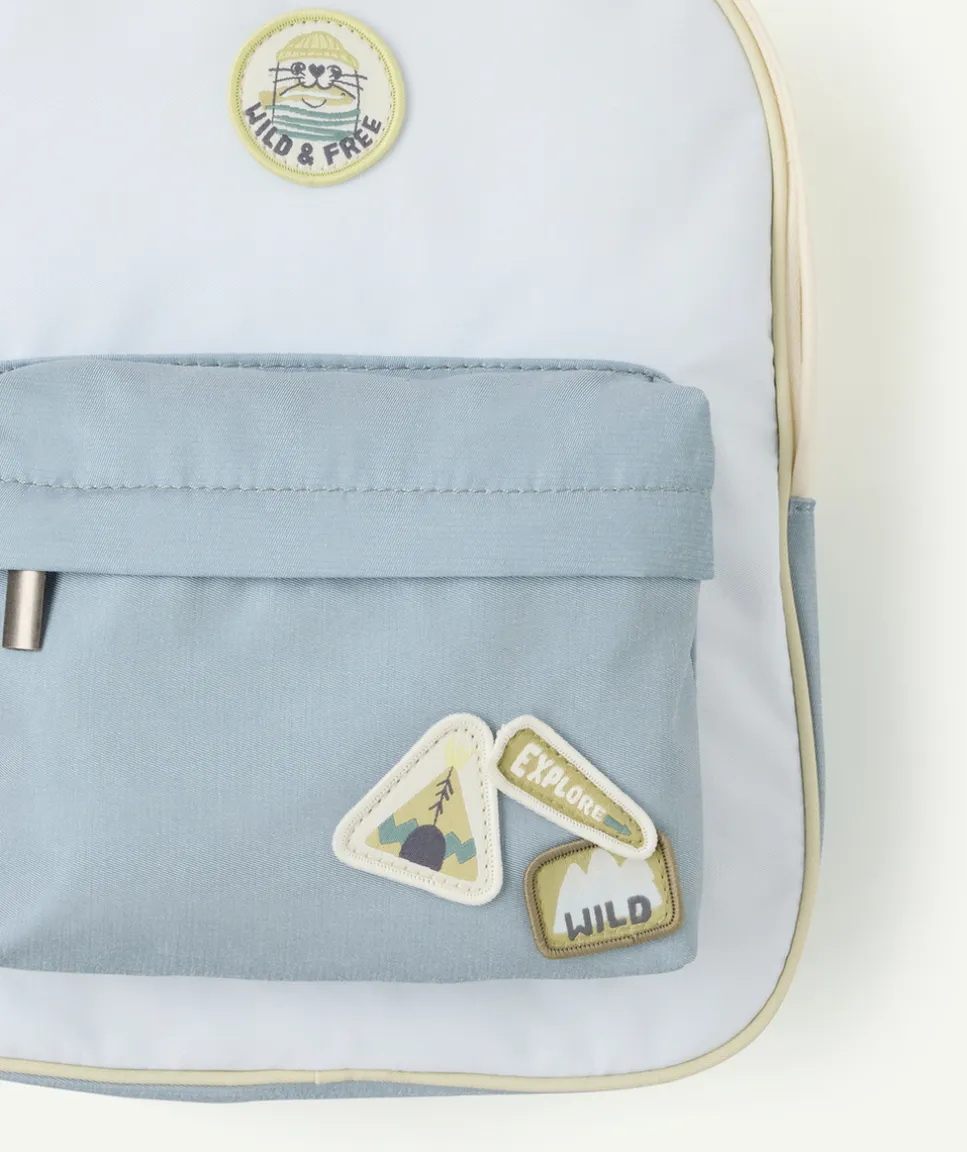 Sac à dos bébé garçon bleu avec badges