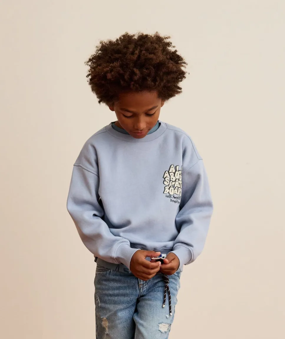 Sweat garçon bleu imprimé skateur
