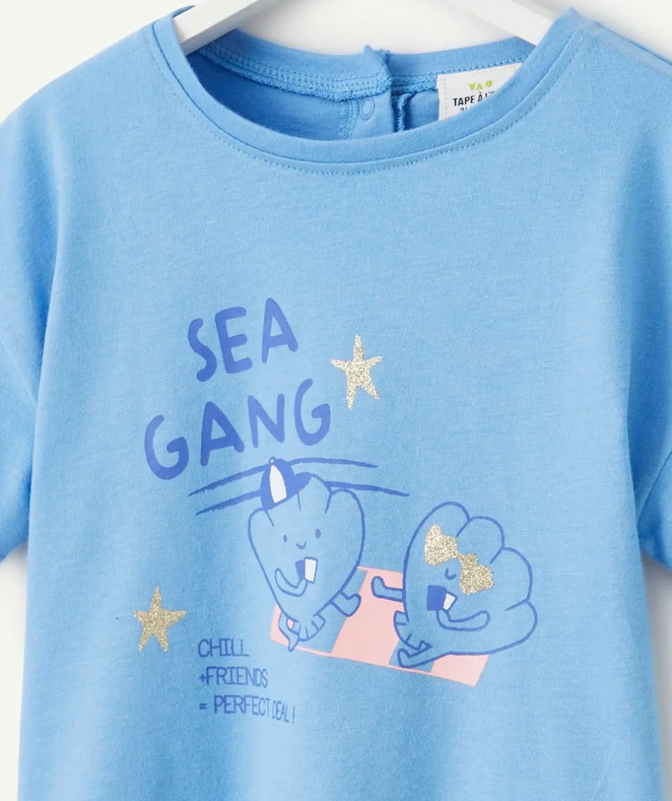 T-shirt bébé fille en coton bio bleu avec motifs coquillages et étoiles pailletées