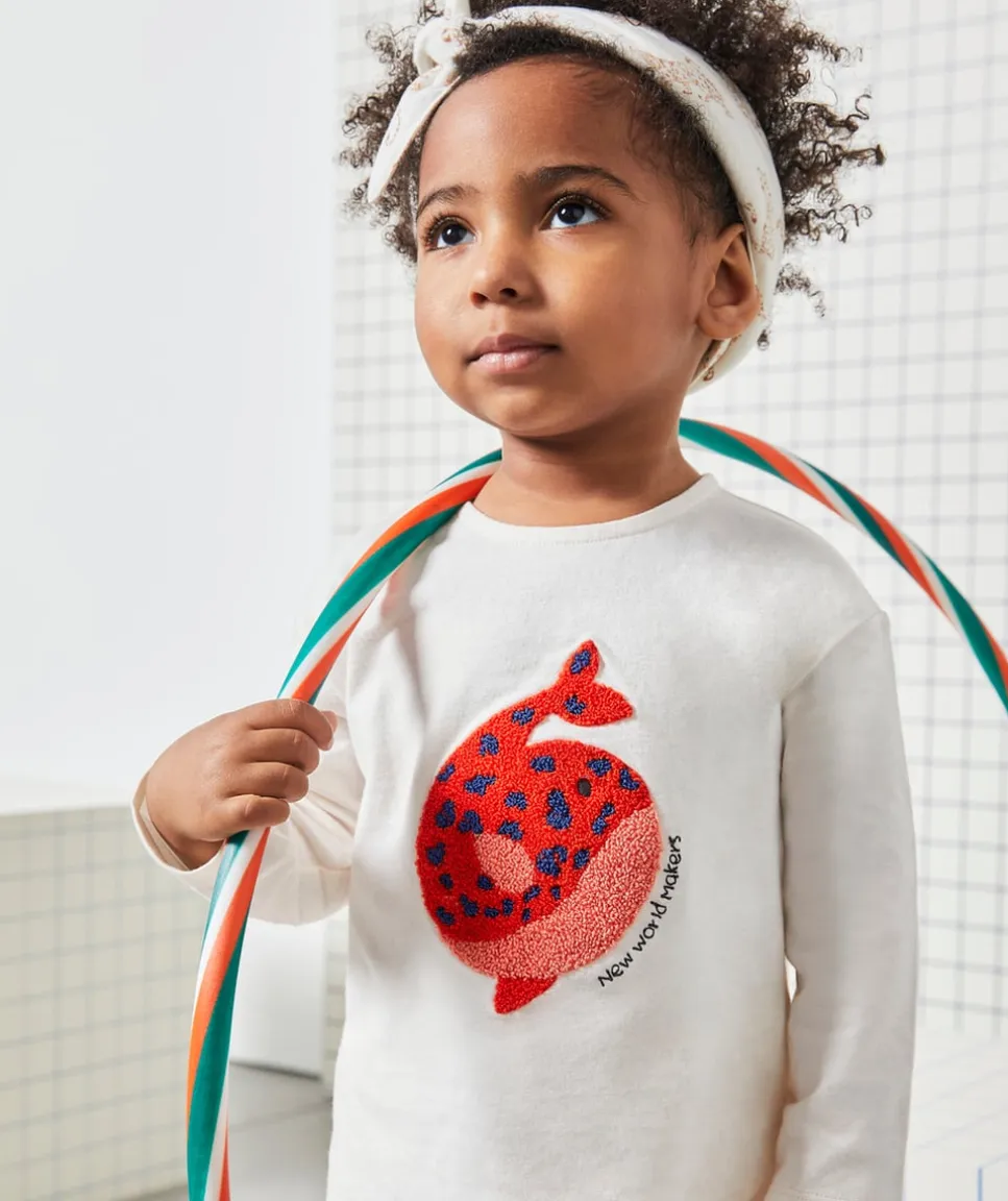 T-shirt bébé fille en coton bio écru avec baleine en bouclette